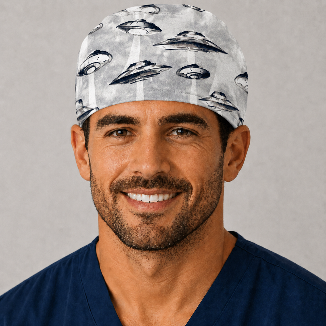 Profile view of UFO &amp; spaceships scrub cap on a male model — handmade-in-USA tie-back surgical hat, fun gift for surgeons, nurses &amp; sci-fi fans.