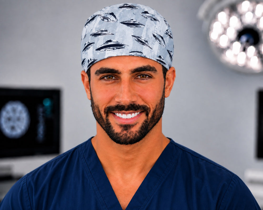 Close-up front view of male model smiling in grey UFO spaceships surgical cap