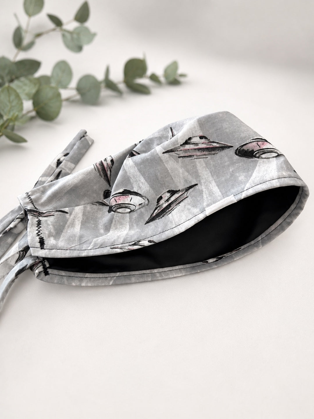 Close-up detail of black satin lining inside UFO spaceships scrub cap, optional satin lining add-on