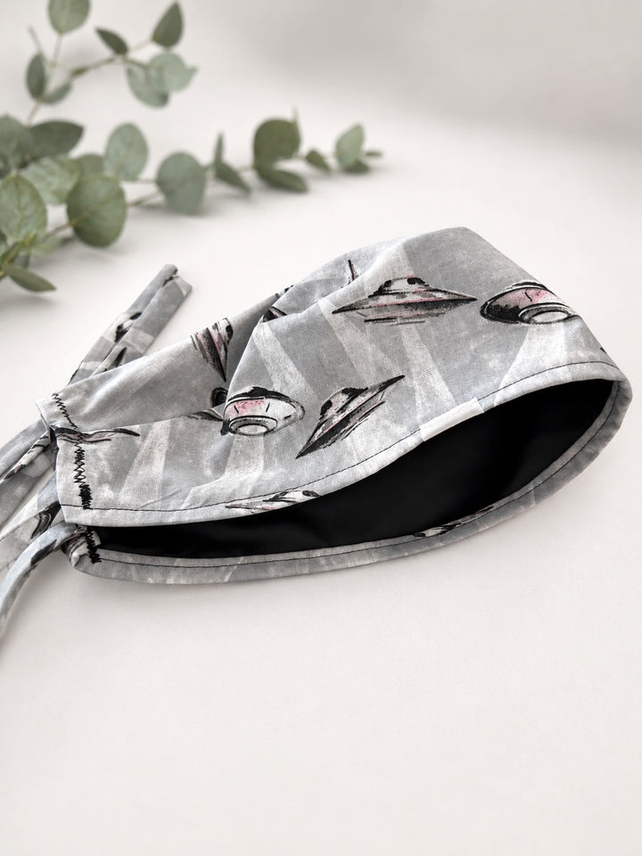 Close-up detail of black satin lining inside UFO spaceships scrub cap, optional satin lining add-on