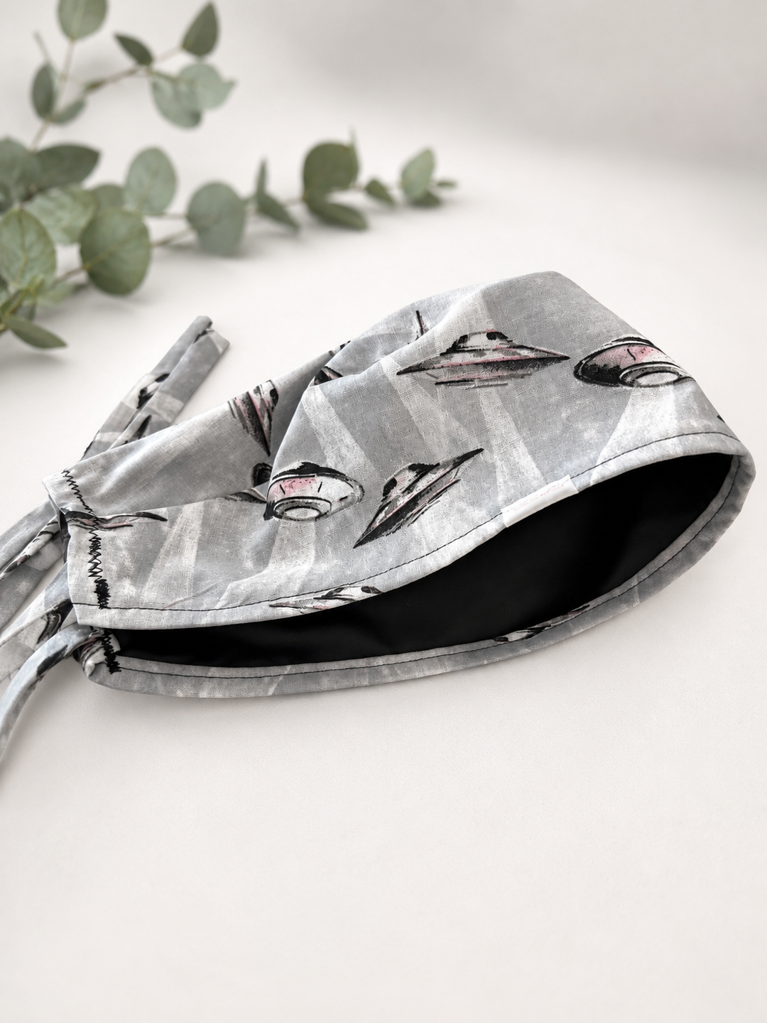 Close-up detail of black satin lining inside a UFO spaceships scrub cap — optional satin lining (+$8), handmade-in-USA OR World surgical hat.