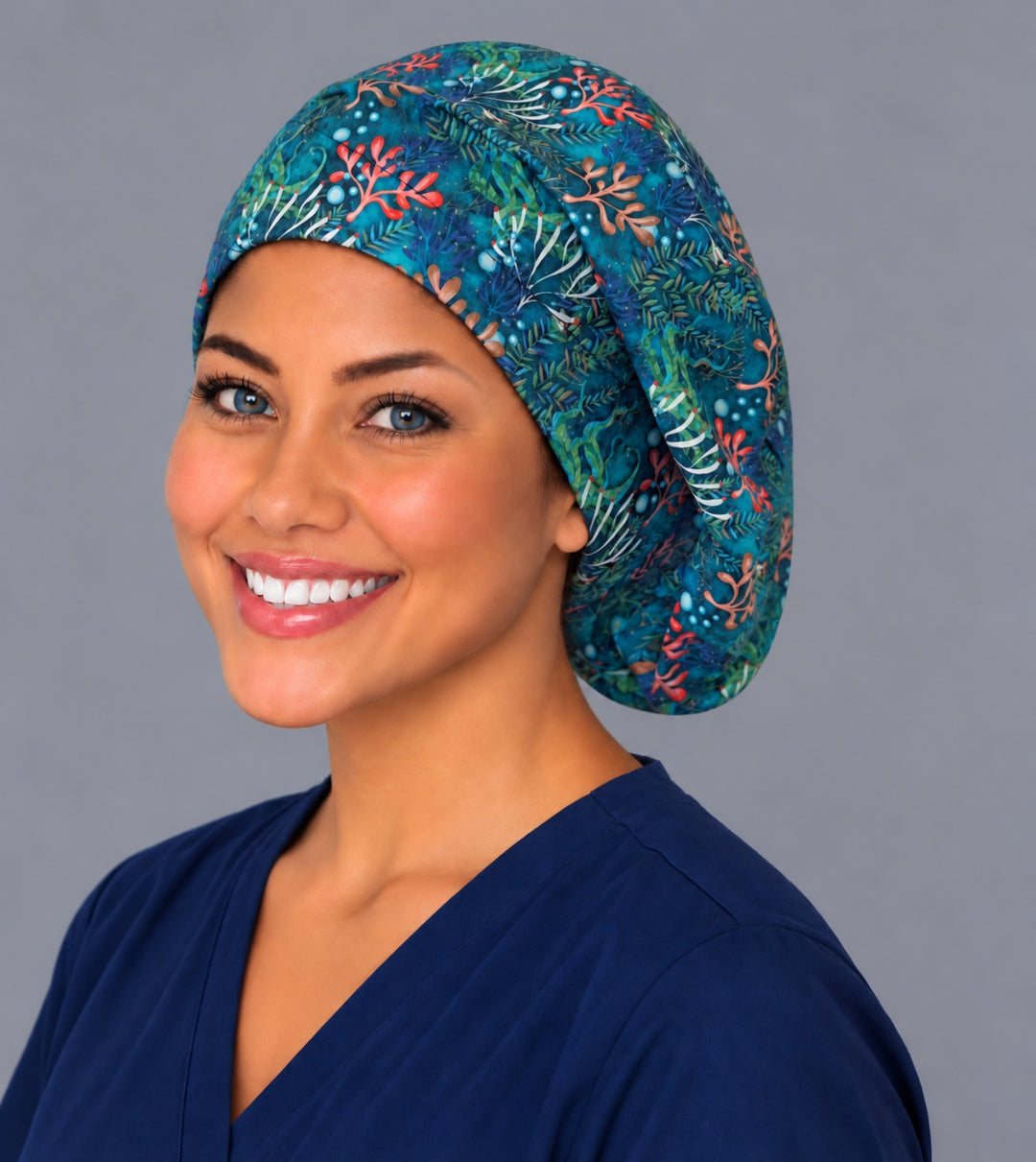 Underwater coral Euro surgical cap, left angled view — elastic adjustable back that secures long or thick hair