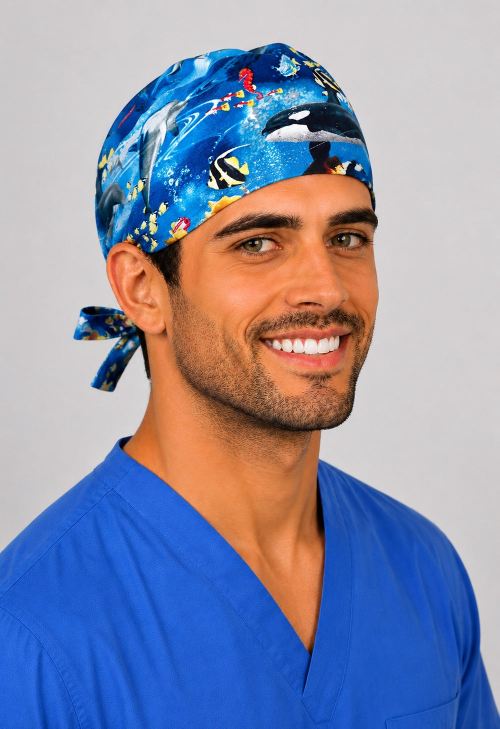 Underwater Paradise ocean scrub cap showing the orca whale on the front, marine sea life tie back surgical hat for men, handmade in USA by OR World.