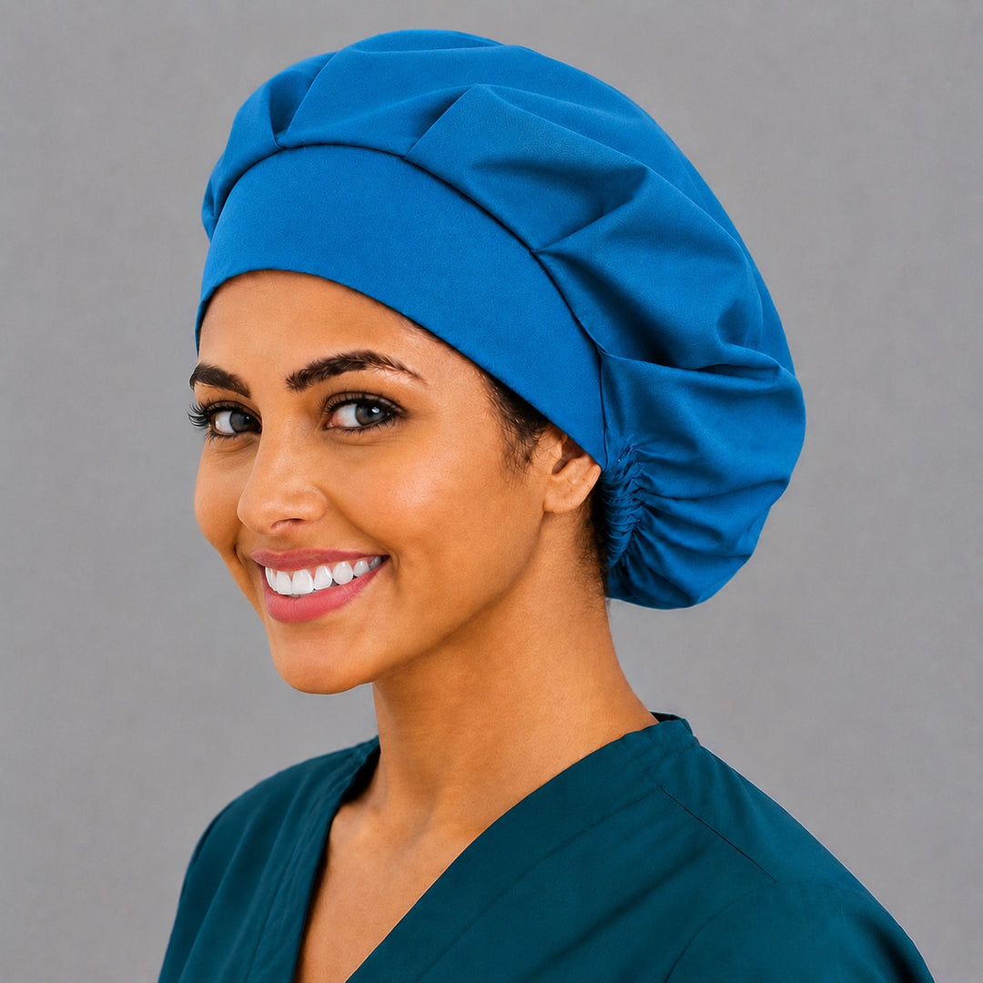 Unisex blue bouffant surgical cap, left angled view — solid color cap for surgeons, dentists and vet teams