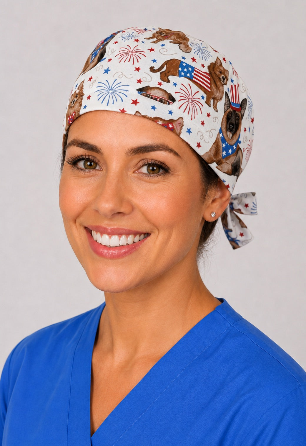 Three-quarter view of USA flag puppy fireworks unisex surgical hat for vet techs and OR nurses
