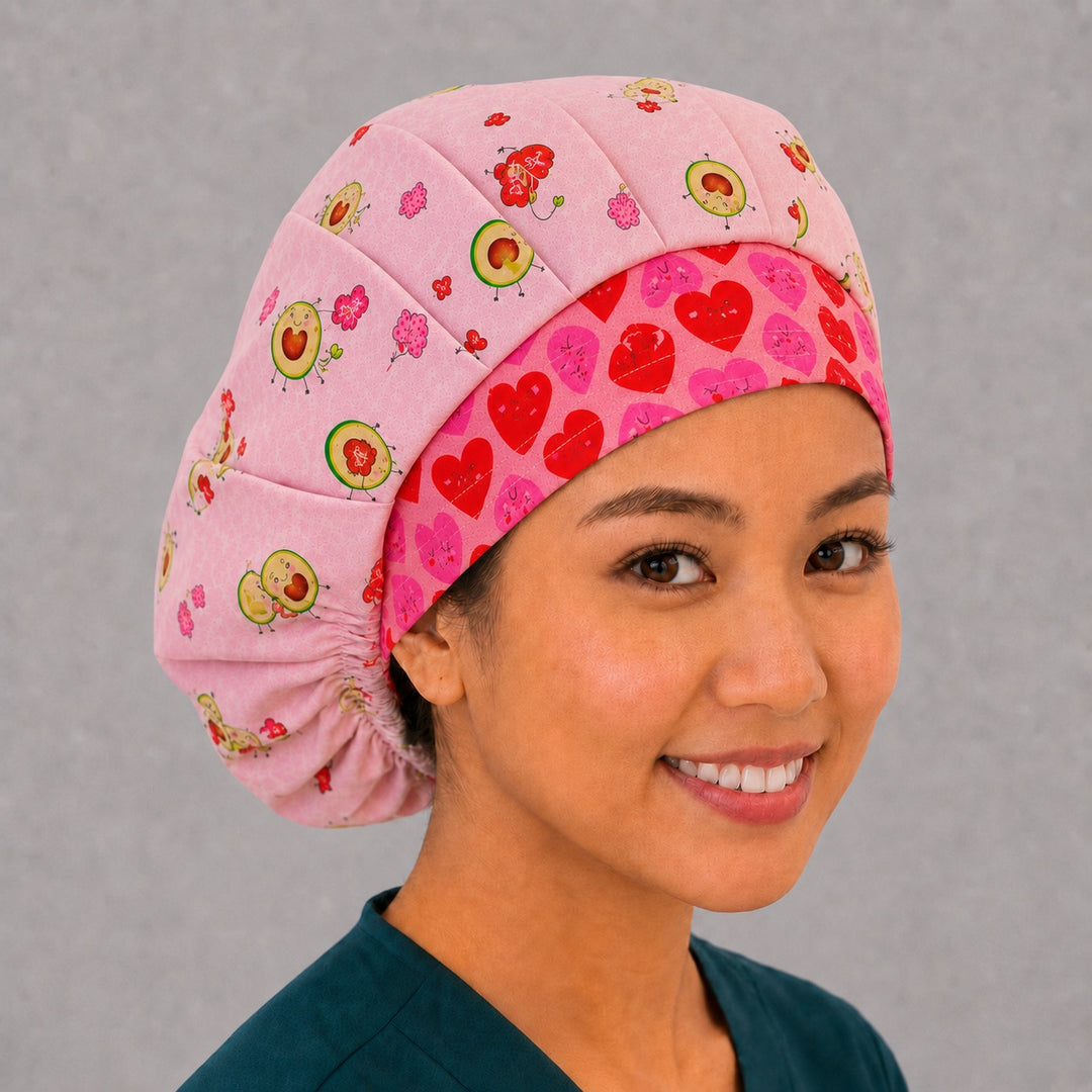 Valentine avocado bouffant scrub cap angled smiling view on a vet tech — cute avocado love print roomy cap that secures long thick hair