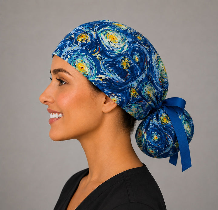 Van Gogh Starry Night ponytail scrub cap left side profile with full ponytail pouch of swirling blue and gold impressionist print and long blue ribbon ties