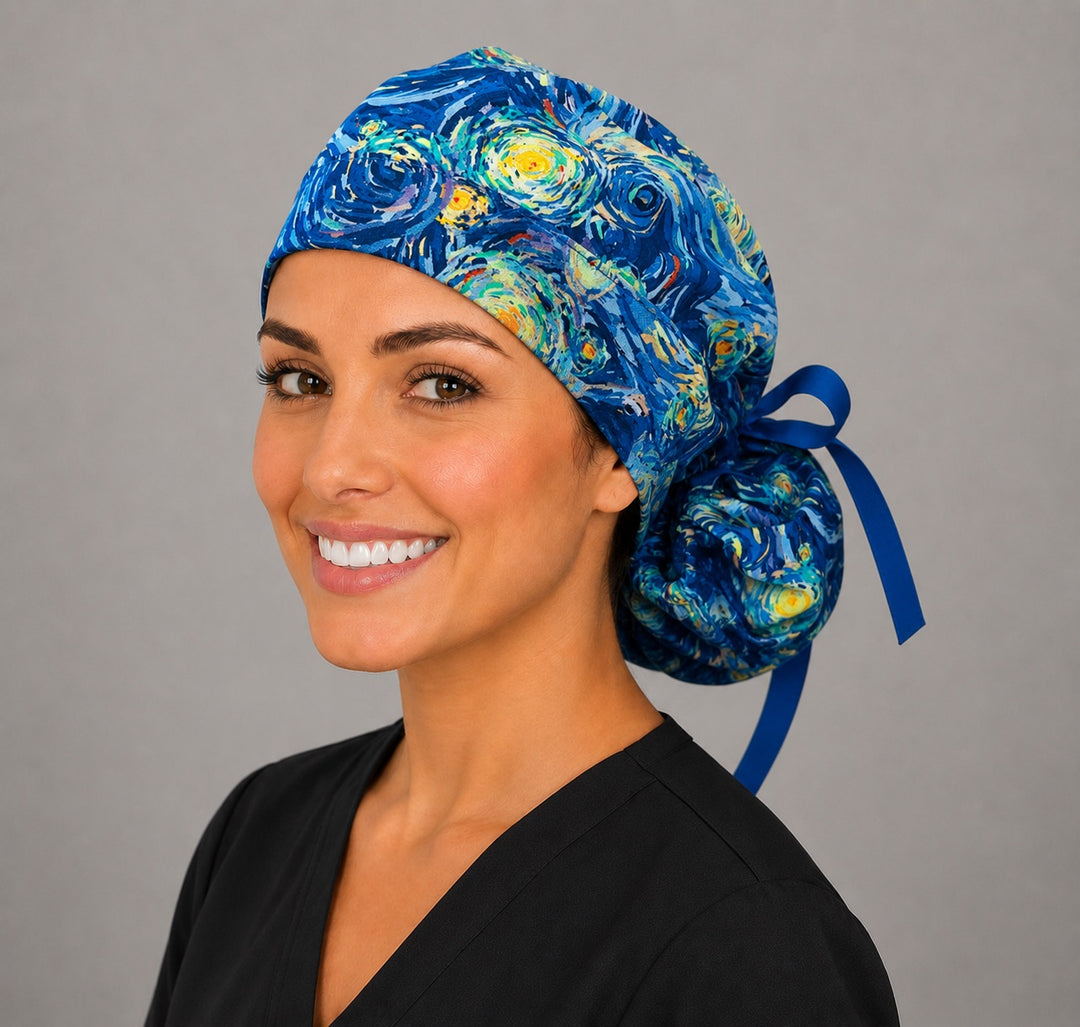 Van Gogh Starry Night ponytail surgical cap right three-quarter angle showing swirling blue, turquoise and gold starry impressionist print with blue ribbon bow