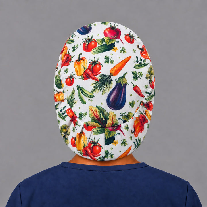 Back view of the vegetable garden Euro scrub cap — elastic gathered back showing the full produce print