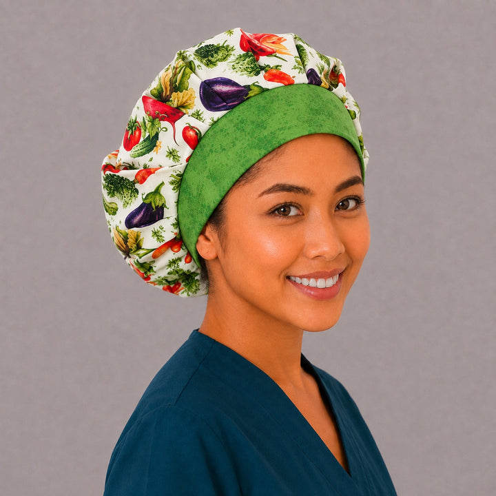 Right angled view of the veggie print bouffant surgical hat — green batik contrast band with garden vegetable crown, roomy breathable cotton cap