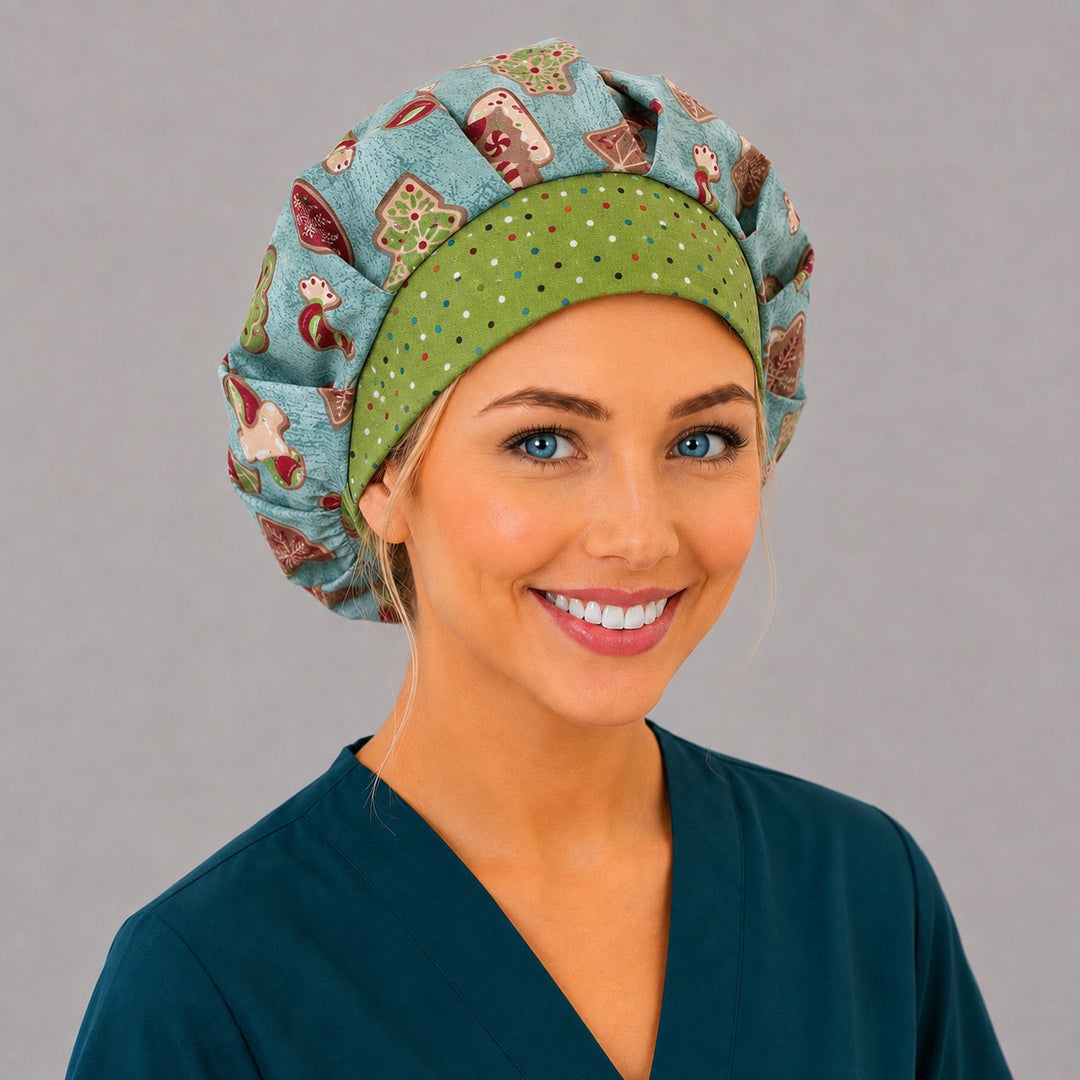 Woman wearing a vintage holiday treats bouffant scrub cap — frosted Christmas cookies on ice blue with a green polka dot band, adjustable women's surgical hat