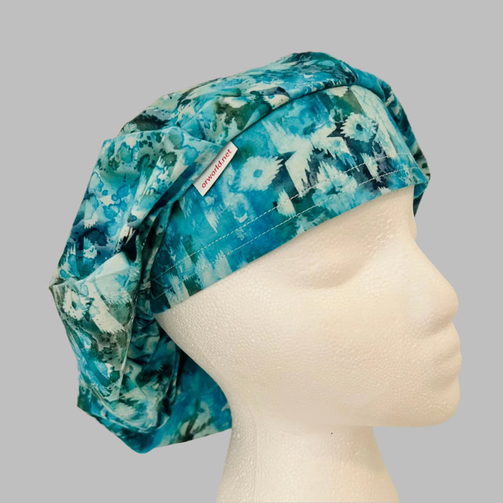 Aqua, teal &amp; white vintage icicle bouffant scrub cap on a model — handmade-in-USA winter surgical hat for women from OR World.