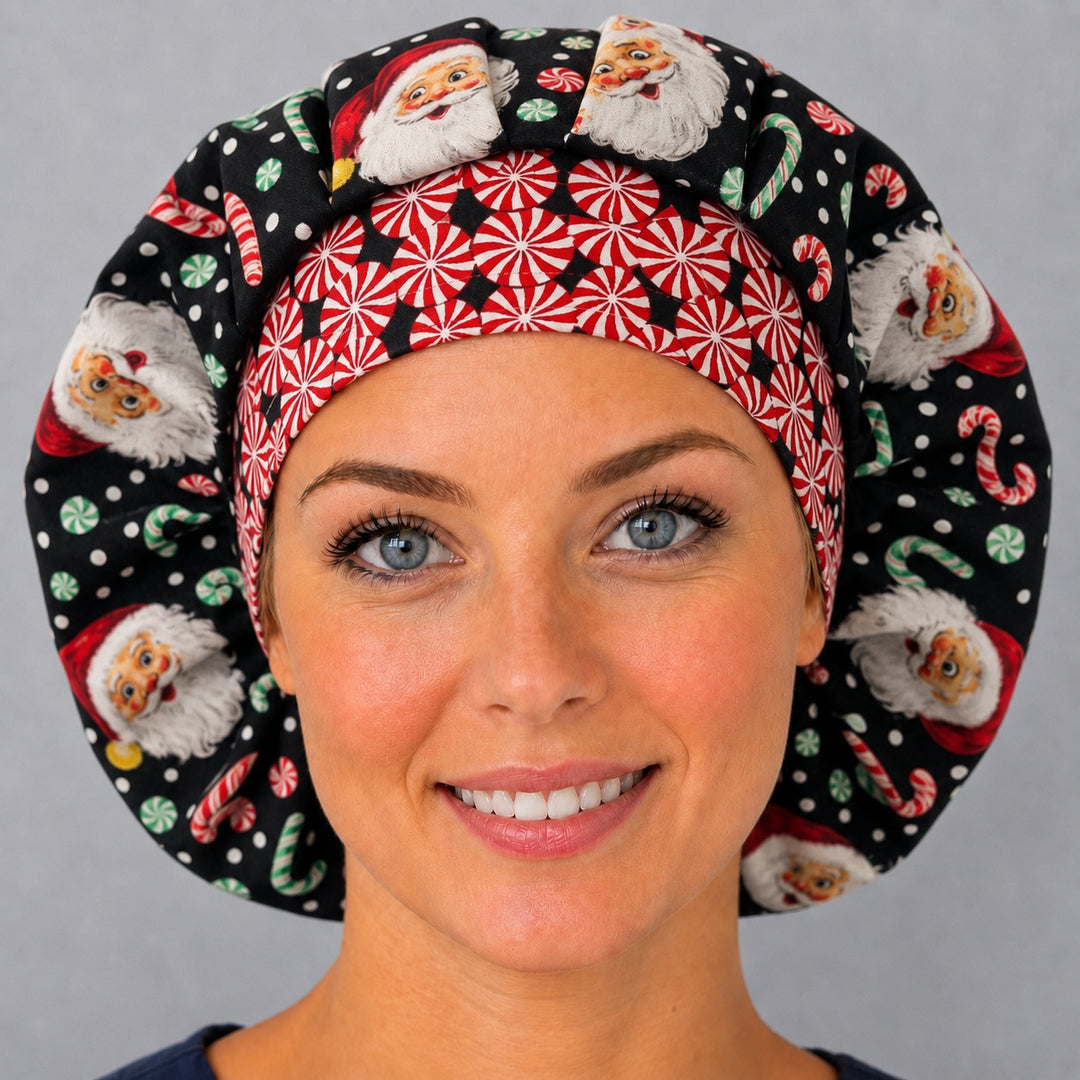 Woman wearing a vintage Santa bouffant scrub cap, front view — old-fashioned Santa faces and candy canes on black with a red peppermint band, adjustable women&