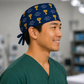 Profile view of "Voted #1 Surgeon by My Patients" trophy scrub cap — handmade-in-USA navy surgical hat, fun gift for surgeons & doctors.