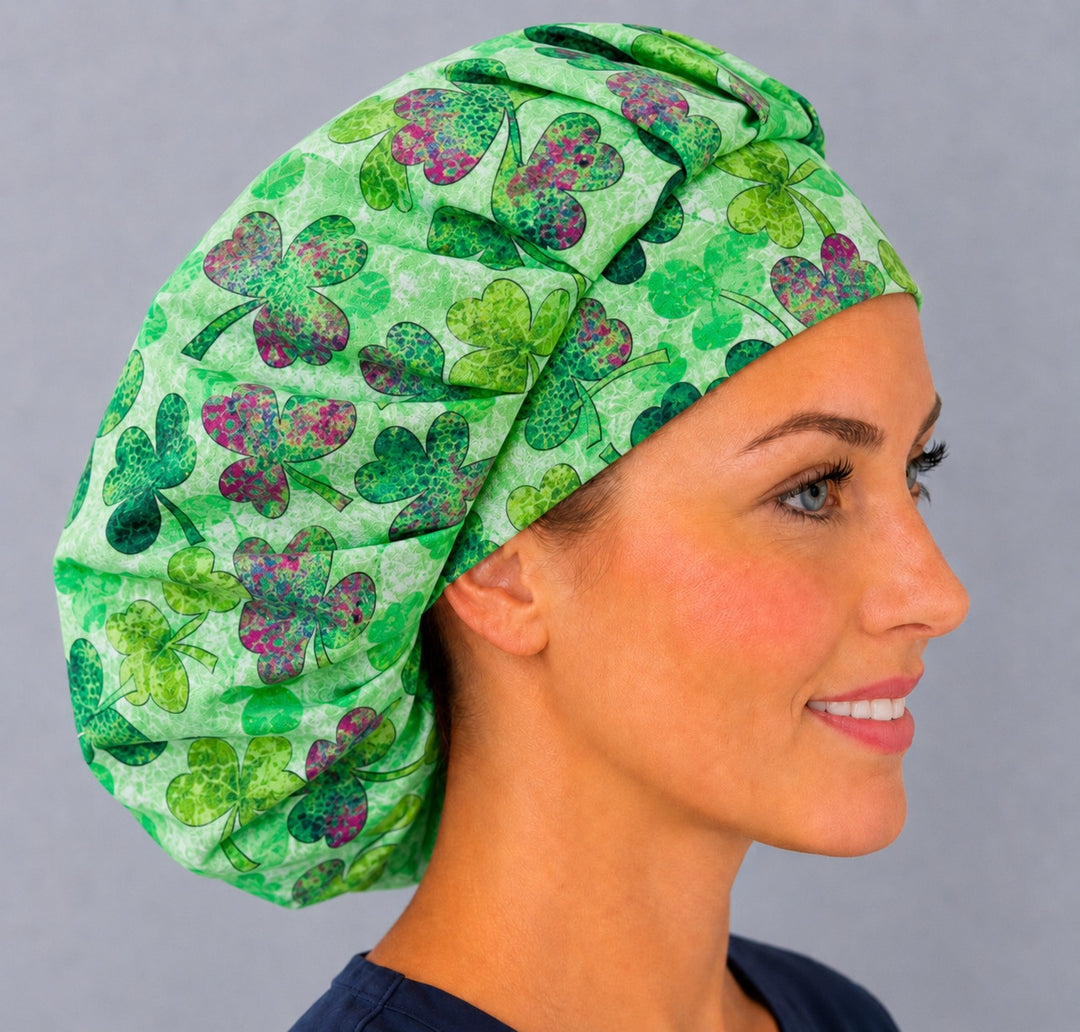 Right side profile of the watercolor shamrock bouffant surgical hat — layered green clover print, roomy breathable cotton cap for nurses