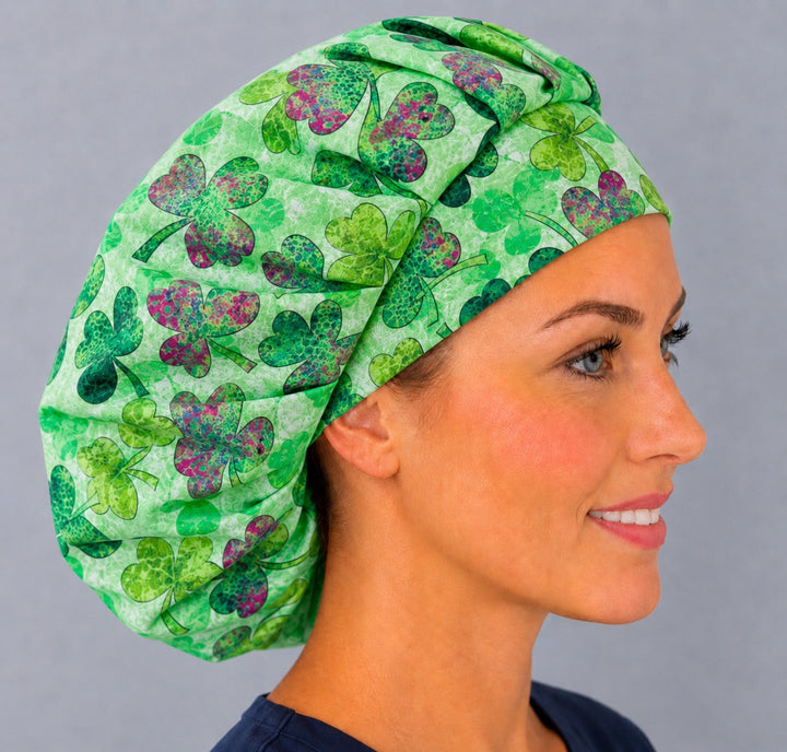 Right side profile of the watercolor shamrock bouffant surgical hat — layered green clover print, roomy breathable cotton cap for nurses
