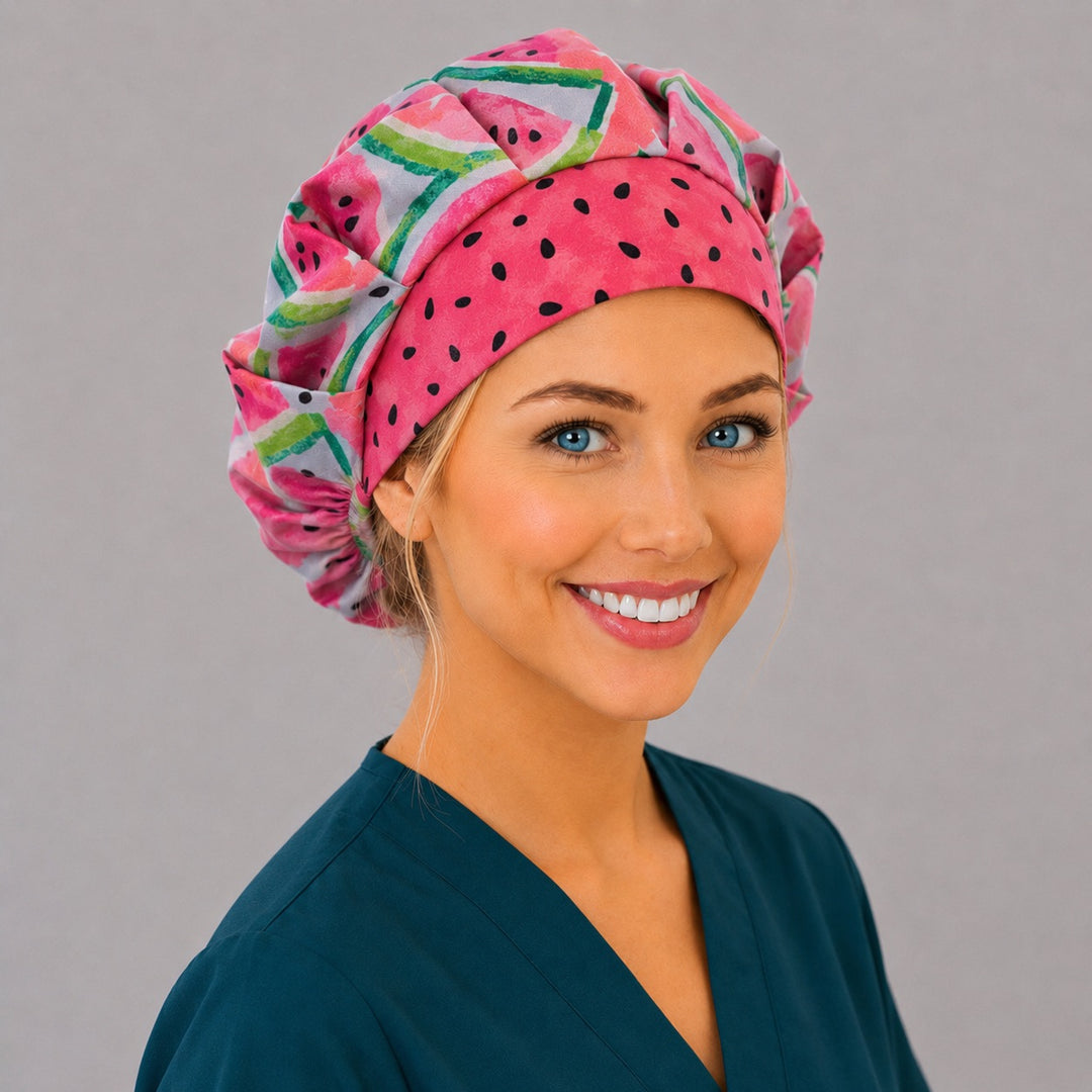 Side view of the watermelon slice bouffant surgical hat — coral and pink fruit print with seed contrast band, roomy breathable cotton cap