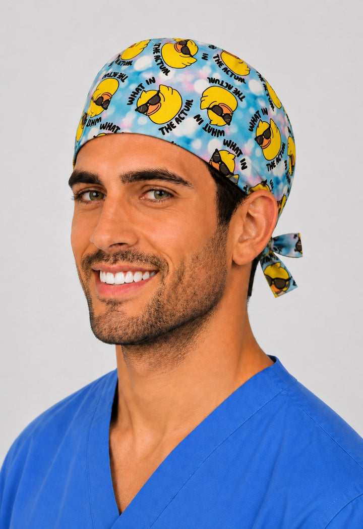 What in the Actual duck scrub cap side view — adjustable tie-back closure, blue tie-dye humor surgical cap for OR nurses