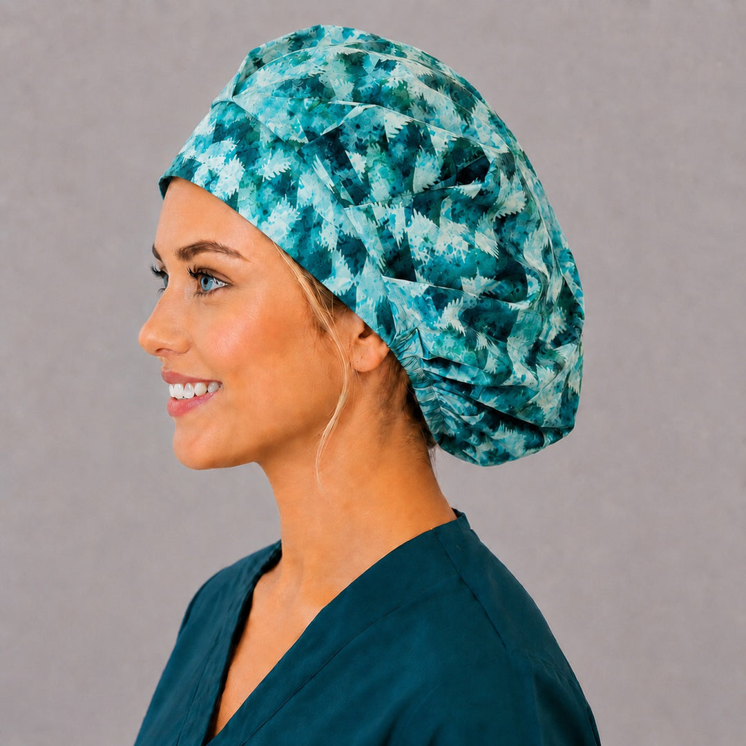 Winter icicle bouffant scrub cap, left side profile — aqua and dark green batik print for OR nurses and surgical techs