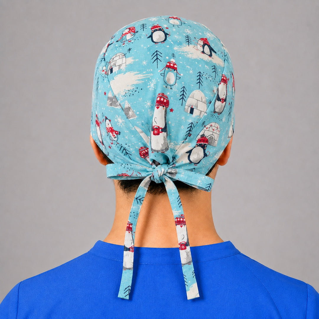 Back view of adjustable tie-back knot on aqua winter penguin unisex surgical hat