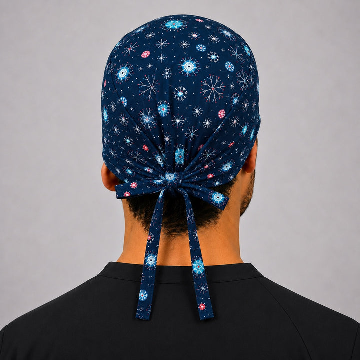 Back view of adjustable tie-back knot on navy winter snowflake Christmas scrub cap surgical hat for men