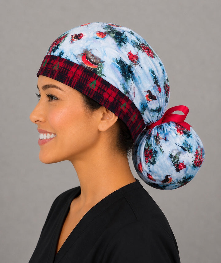 Winter snowman ponytail scrub cap back view close-up showing gathered pouch full of snowmen, red cardinals, trees and holly on snowy blue with red ribbon bow