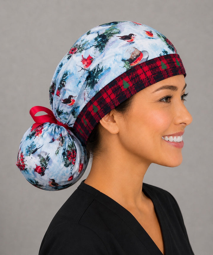Winter snowman ponytail scrub cap left side profile showing gathered pouch of snowmen, red cardinals and trees on snowy blue with red ribbon tie