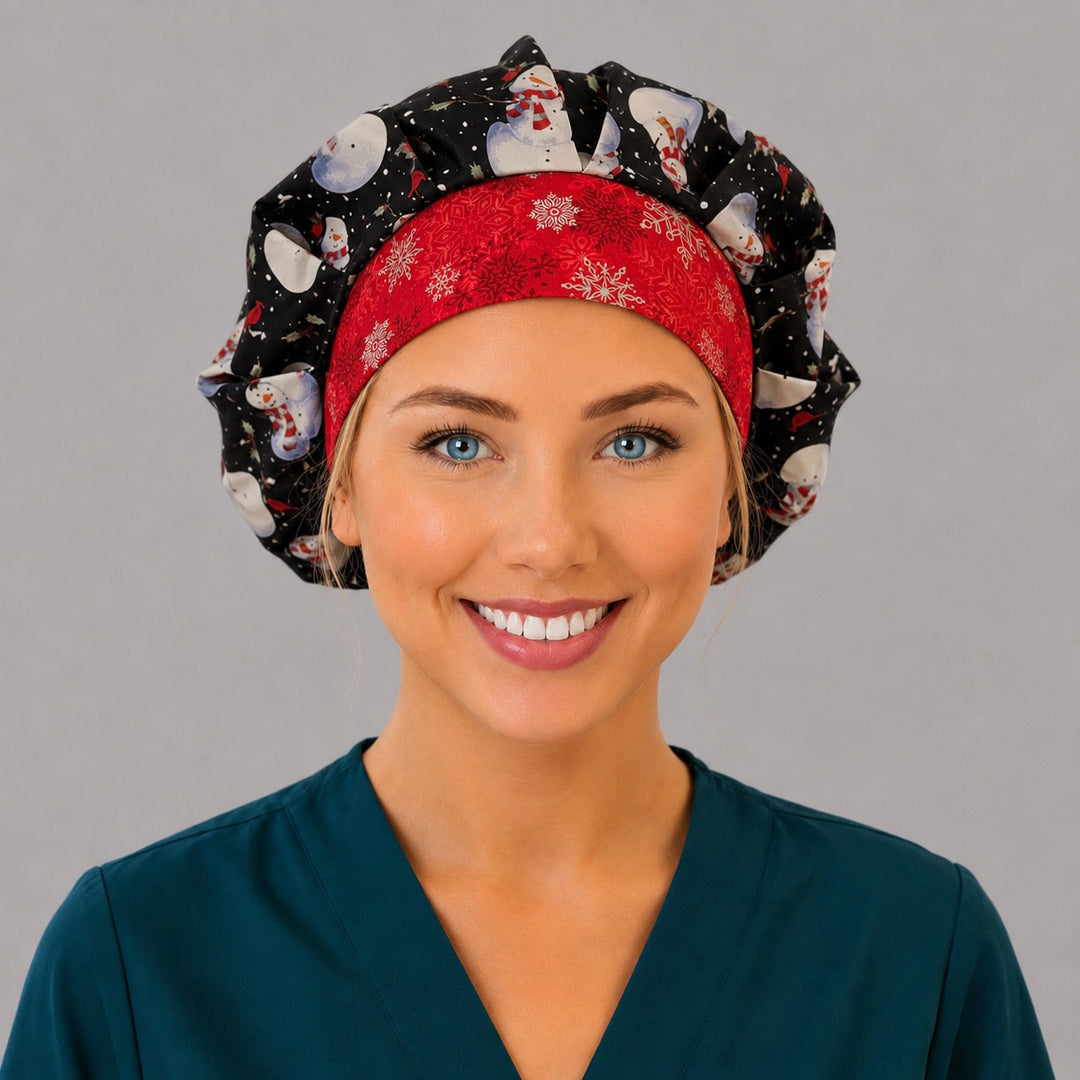 Woman wearing a wintery snowman bouffant scrub cap, front view — old-fashioned snowmen on black with a red snowflake band, adjustable women's surgical hat