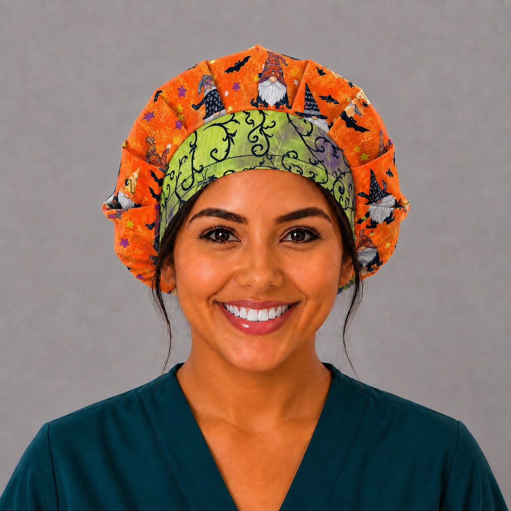 Angled view of the witch gnome bouffant surgical hat — green gothic vine contrast band with orange bat print, roomy cotton cap for nurses