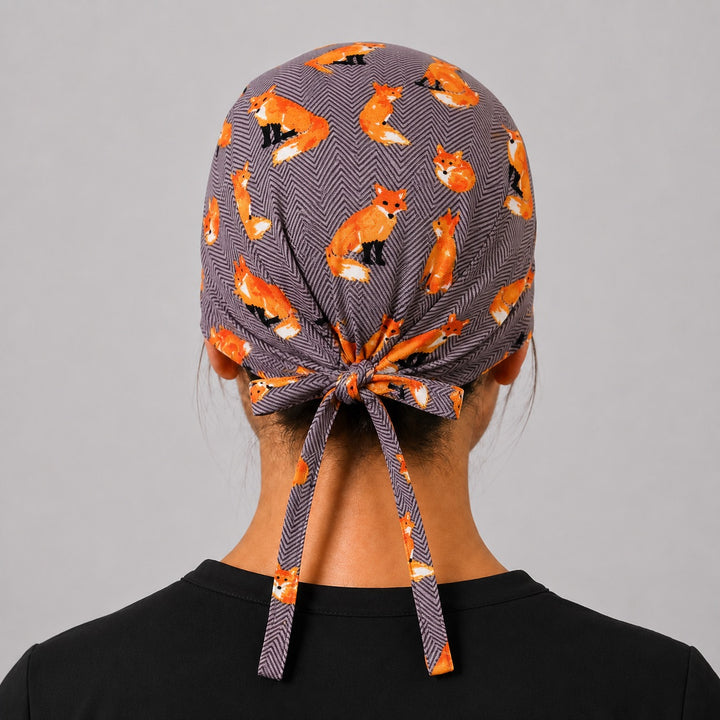 Back view of adjustable tie-back knot on gray woodland fox unisex surgical hat