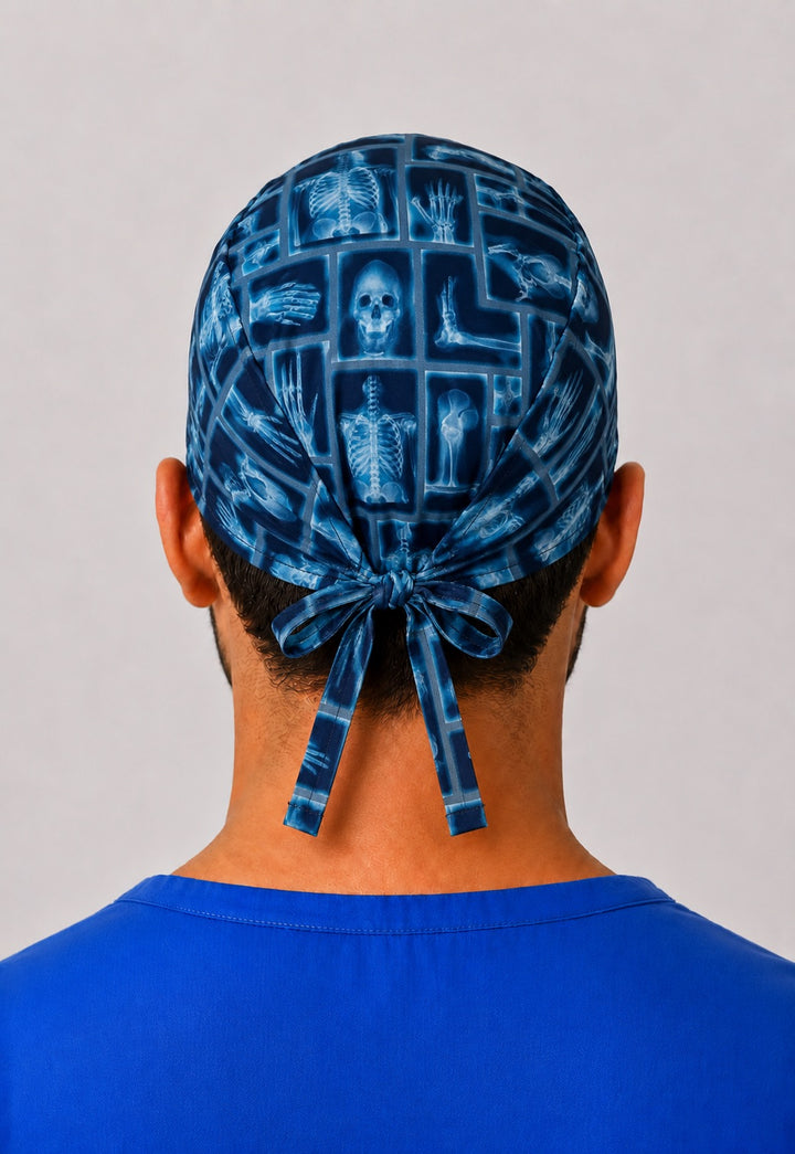 Back view of blue x-ray skeleton scrub cap showing adjustable tie-back closure — radiology tech nurse cap gift by OR World.