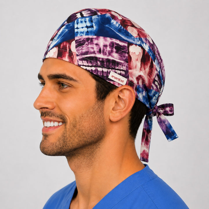 Side profile of the X-ray print radiology and dental tie-back scrub cap showing the colorful radiograph collage and tie closure