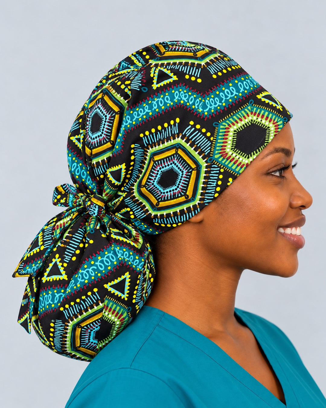 Left side profile of an XXL-capacity ponytail scrub cap for thick hair, where the turquoise swirl stripe wraps from temple to the full ponytail pouch