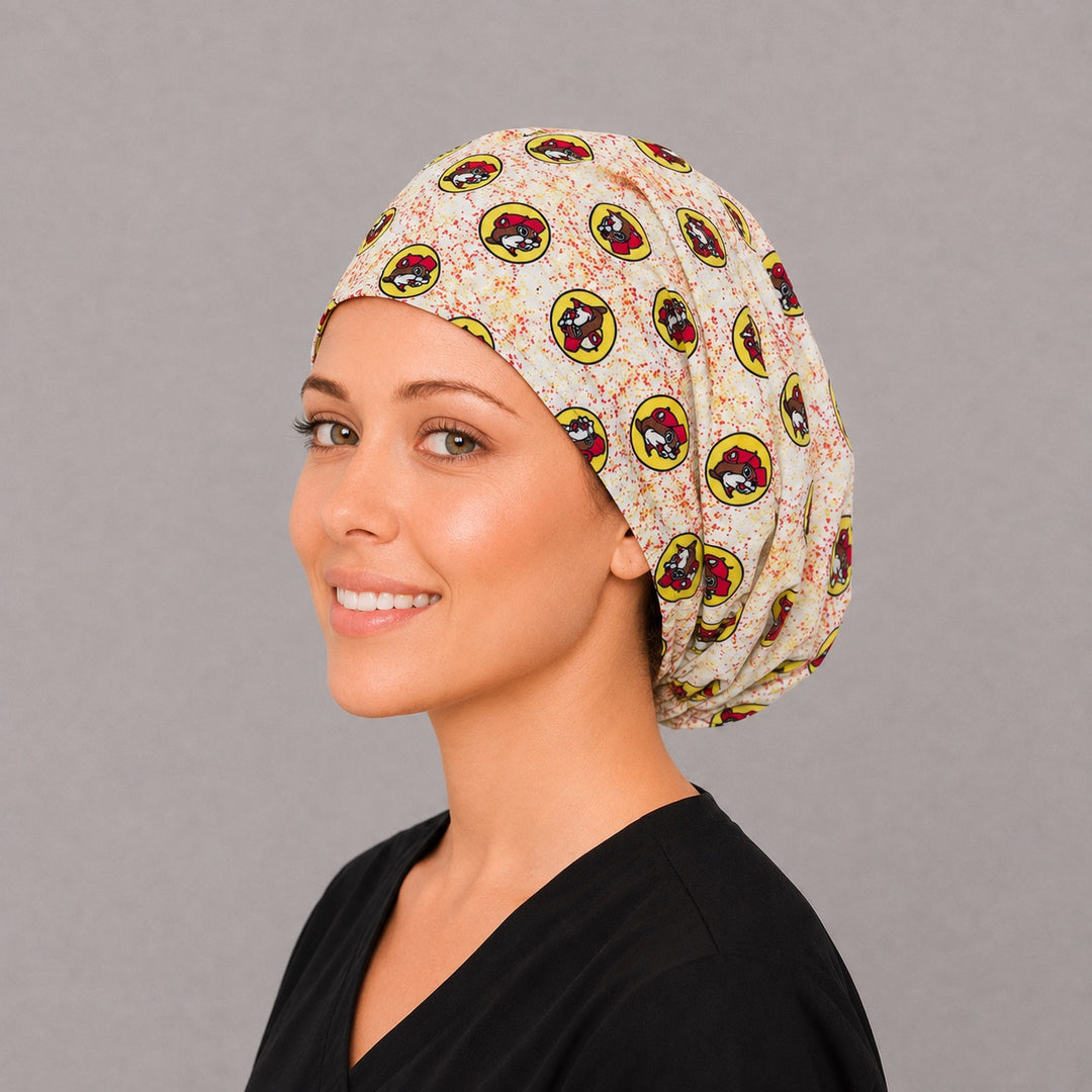 Yellow beaver badge Euro cap for women, right angled smiling view — handmade funny animal print surgical cap, USA made
