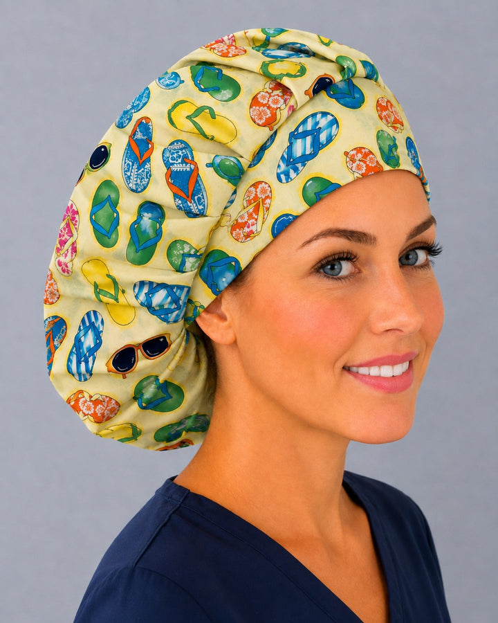 Yellow flip flop bouffant scrub cap, left side profile — deep gathered fit that secures long thick or braided hair
