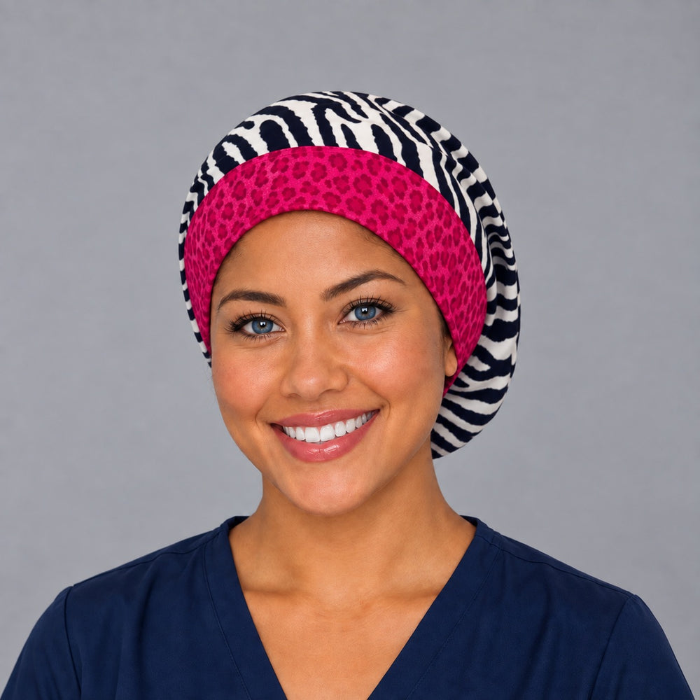 Woman wearing a zebra print Euro scrub cap, front view — navy and white stripes with a hot pink cheetah band, adjustable surgical hat