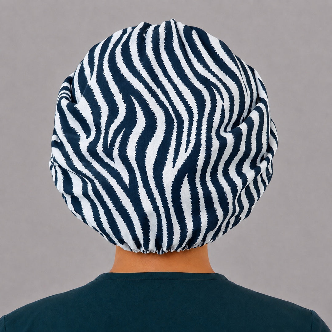 Back view of the zebra print bouffant scrub cap — full gathered coverage showing black and white stripes across the crown