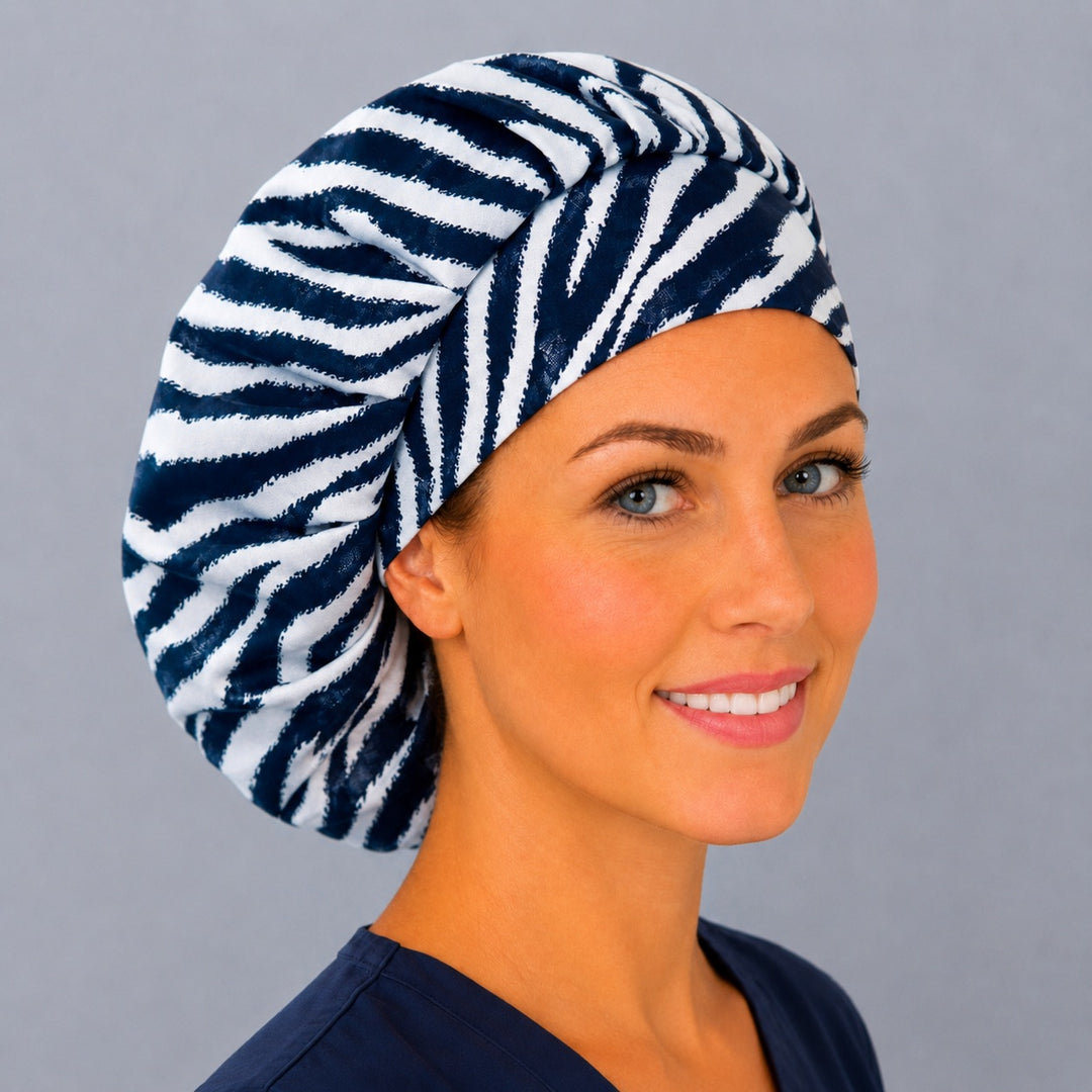 Zebra stripe bouffant cap for women, right angled smiling view — handmade black and white animal print surgical cap, USA made