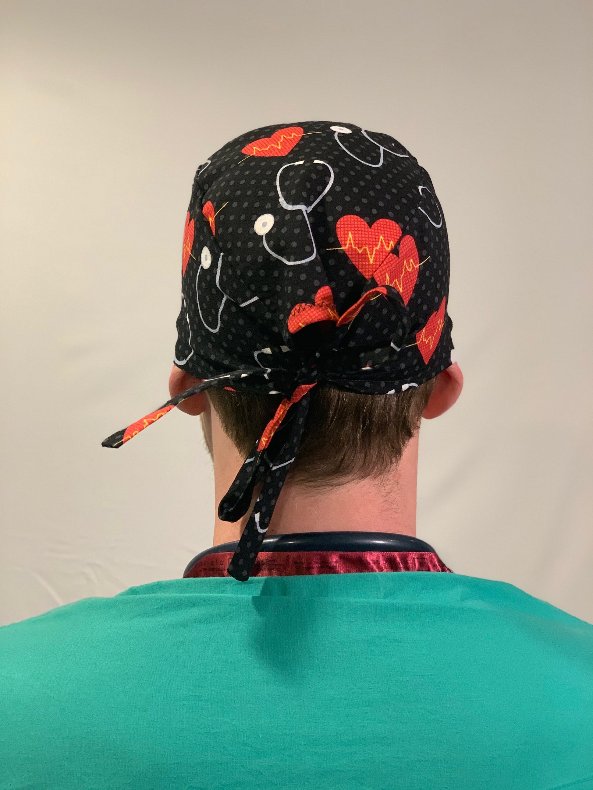 Scrub Cap-Men-Simple-Black-Stethoscope-Saving The Day OR World LLC Surgical Caps-Hats-Scrub Caps-Bouffants-Fun patterns for OR Nurses-Surgical Nurses-Scrub Techs-Surgical Technologists-Technicians-Dentistry-Food Production-Cancer Patients and other medical professionals!   Scrub Cap-Offers a unique, gender neutral design that wraps around head with the ability to tie string in multiple variations. This top-rated, 100% cotton pattern was customized for your protection, comfort and style!