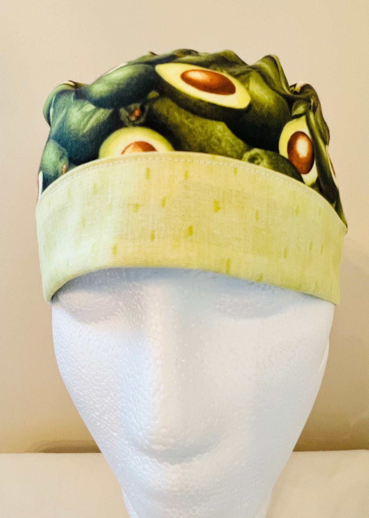 ponytail surgical scrub hat with green avocados - front