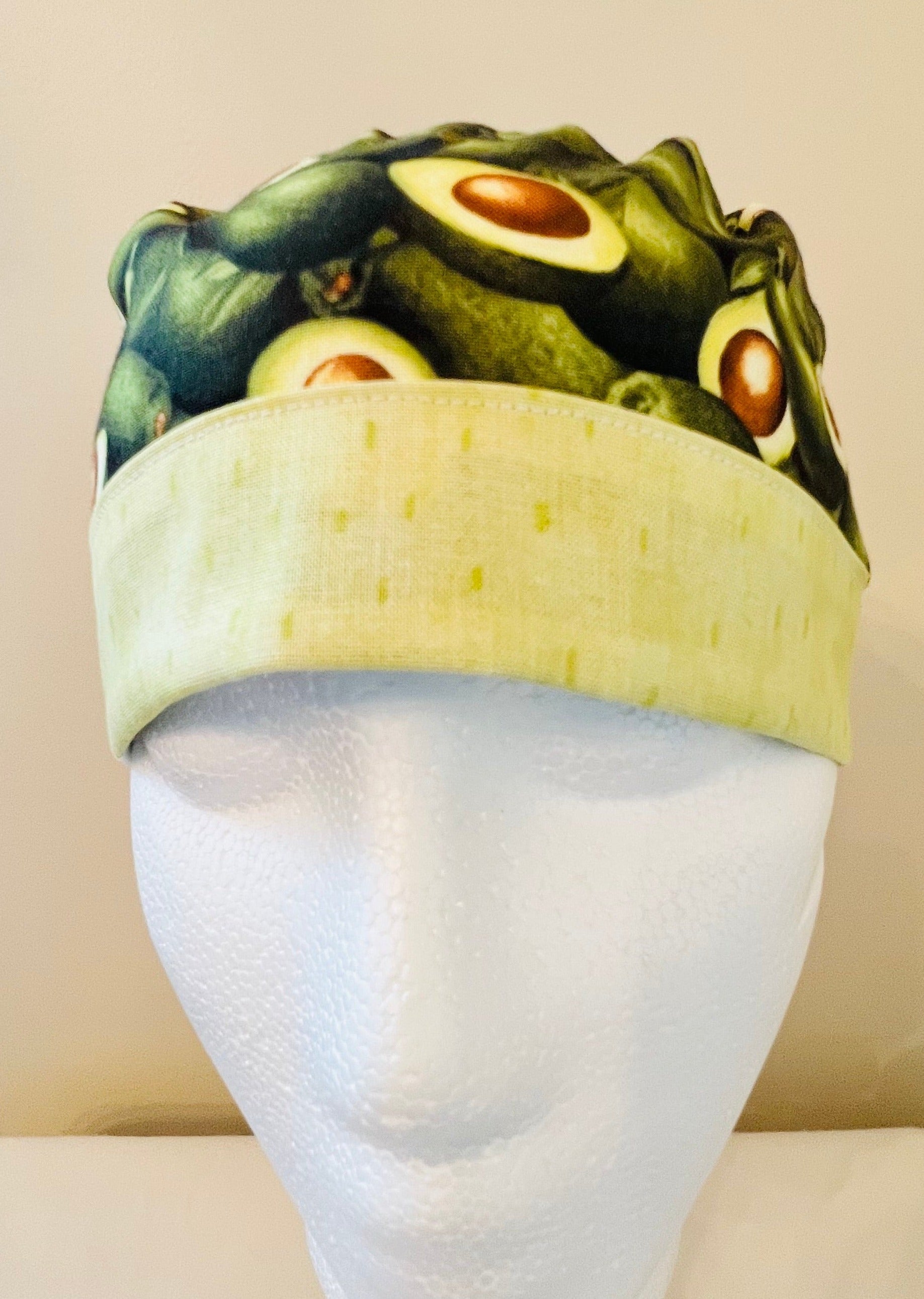 ponytail surgical scrub hat with green avocados - front